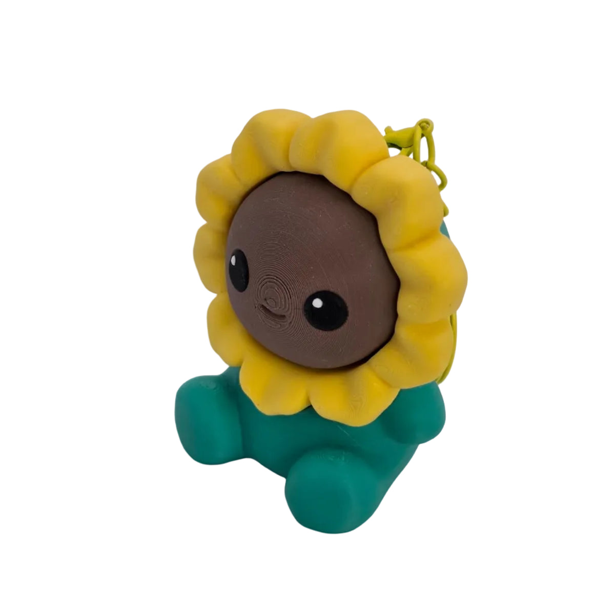 Cliqueur tournesol souriant vu de trois quarts, avec son visage marron entouré de pétales jaunes.